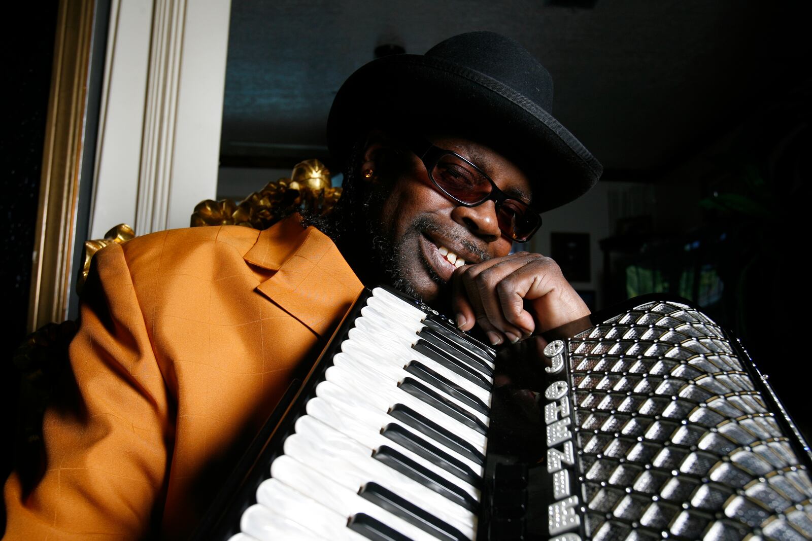 FILE - Son of the Zydeco King Clifton Chenier, C.J. Chenier holds his father's accordion in Houston, May 29, 2006. (Ben Desoto/Houston Chronicle via AP, File)