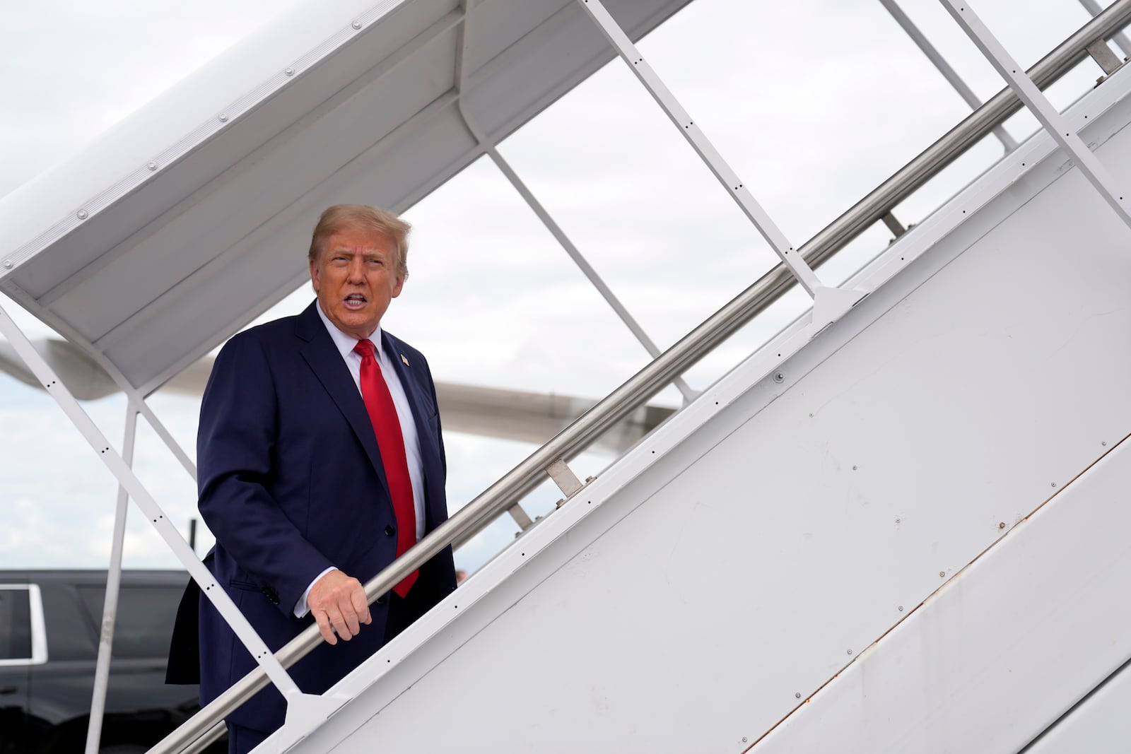 Republican presidential nominee former President Donald Trump boards his plane at West Palm Beach International Airport, Saturday, Oct. 5, 2024, in West Palm Beach, Fla., as he travels to a campaign rally in Butler, Pa. (AP Photo/Evan Vucci)