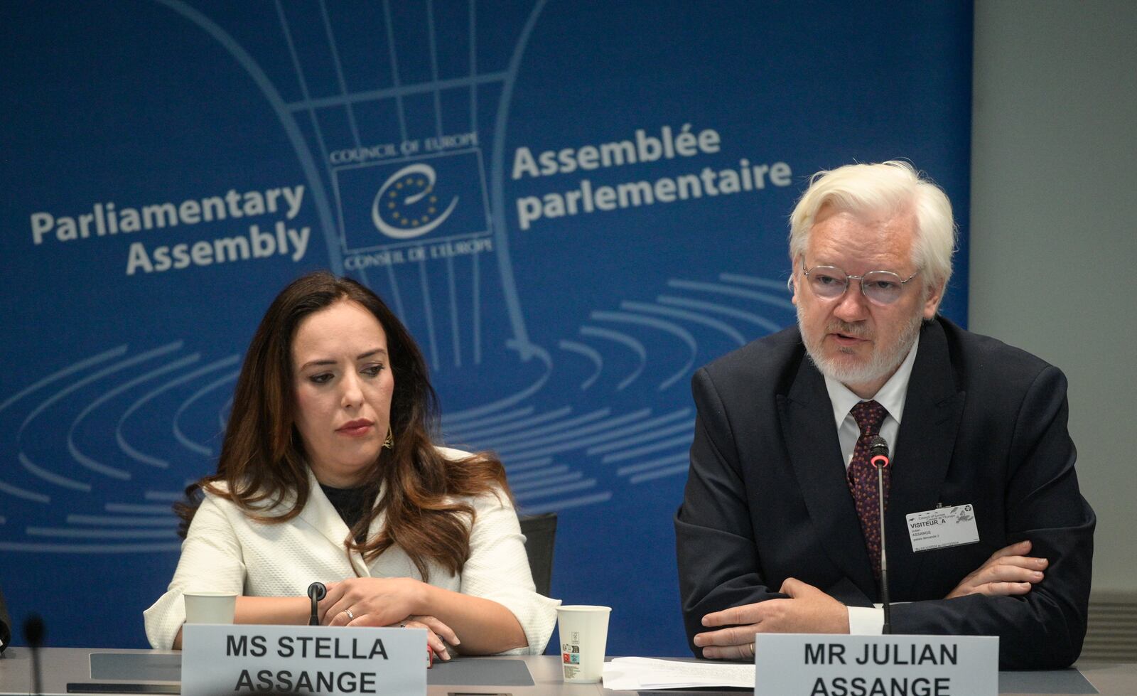 Wikileaks founder Julian Assange, right, assesses the Council of Europe while his wife Stella Assange sits next to him, in Strasbourg, eastern France, Tuesday, Oct. 1, 2024. (AP Photo/Pascal Bastien)