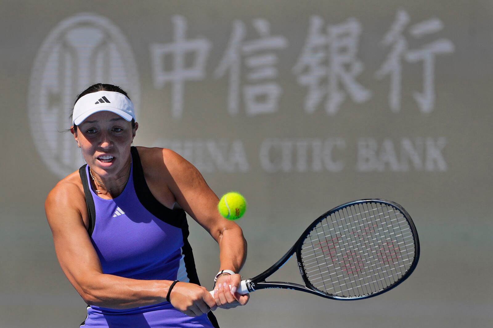 Jessica Pegula of the United States returns a shot from Paula Badosa of Spain in a women's singles match for the China Open tennis tournament held at the National Tennis Center in Beijing, Tuesday, Oct. 1, 2024. (AP Photo/Ng Han Guan)