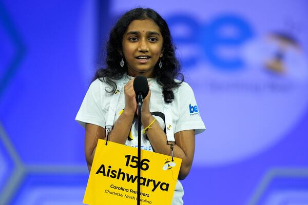 Aishwarya Kallakuri, 14, of Charlotte, N.C., reacts after spelling a word correctly in the semifinals of the Scripps National Spelling Bee, Wednesday, May 28, 2025, in Oxon Hill, Md. (AP Photo/Julia Demaree Nikhinson)