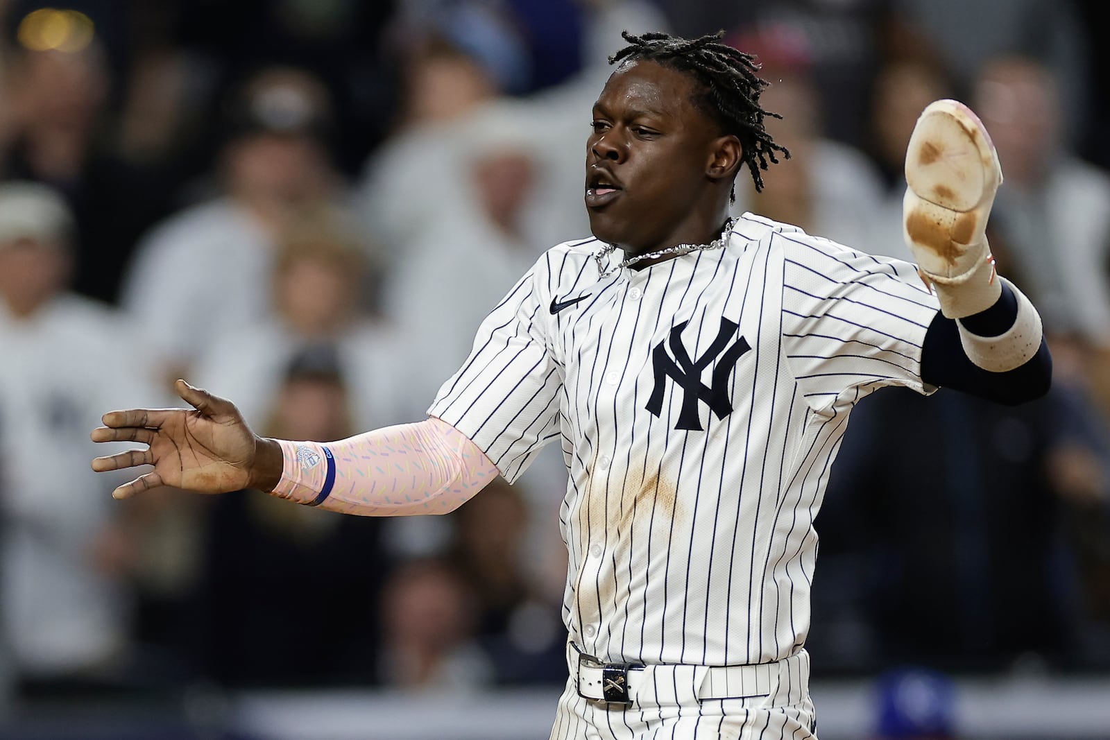 New York Yankees' Jazz Chisholm Jr. reacts as he scores against the Kansas City Royals during the seventh inning of Game 1 of the American League baseball division series, Saturday, Oct. 5, 2024, in New York. (AP Photo/Adam Hunger)