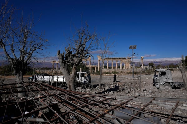 Damaged vehicles seen in front part of the Roman temples of Baalbek in eastern Lebanon, Thursday, Nov. 28, 2024. (AP Photo/Hassan Ammar)