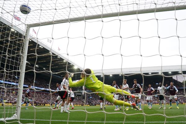 Aston Villa's Youri Tielemans, second from left, scores the opening goal during the English Premier League soccer match between Aston Villa and Fulham at Villa Park, Birmingham, England, Saturday, May 3, 2025. (Nick Potts/PA via AP)