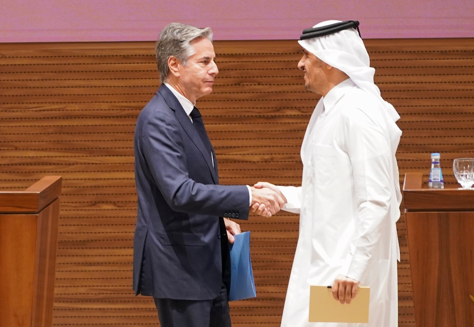 U.S. Secretary of State Antony Blinken, left, and Qatari Prime Minister and Foreign Minister Mohammed bin Abdulrahman Al Thani shake hands as they attend a press conference in Doha, Qatar, Thursday, Oct. 24, 2024. (Nathan Howard/Pool Photo via AP)