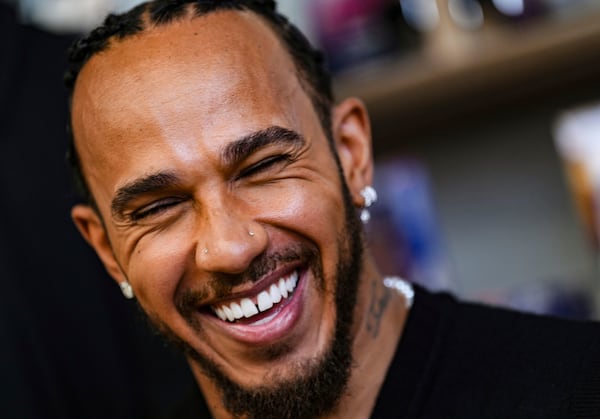 F1 driver Lewis Hamilton reacts uring the official opening of the brand-new flagship Fanatics Collectibles store on Regent Street in London, Friday April 25, 2025. (Bradley Collyer/PA via AP)