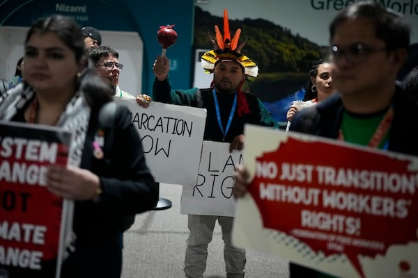 Activists participate in a demonstration at the COP29 U.N. Climate Summit, Saturday, Nov. 16, 2024, in Baku, Azerbaijan. (AP Photo/Rafiq Maqbool)