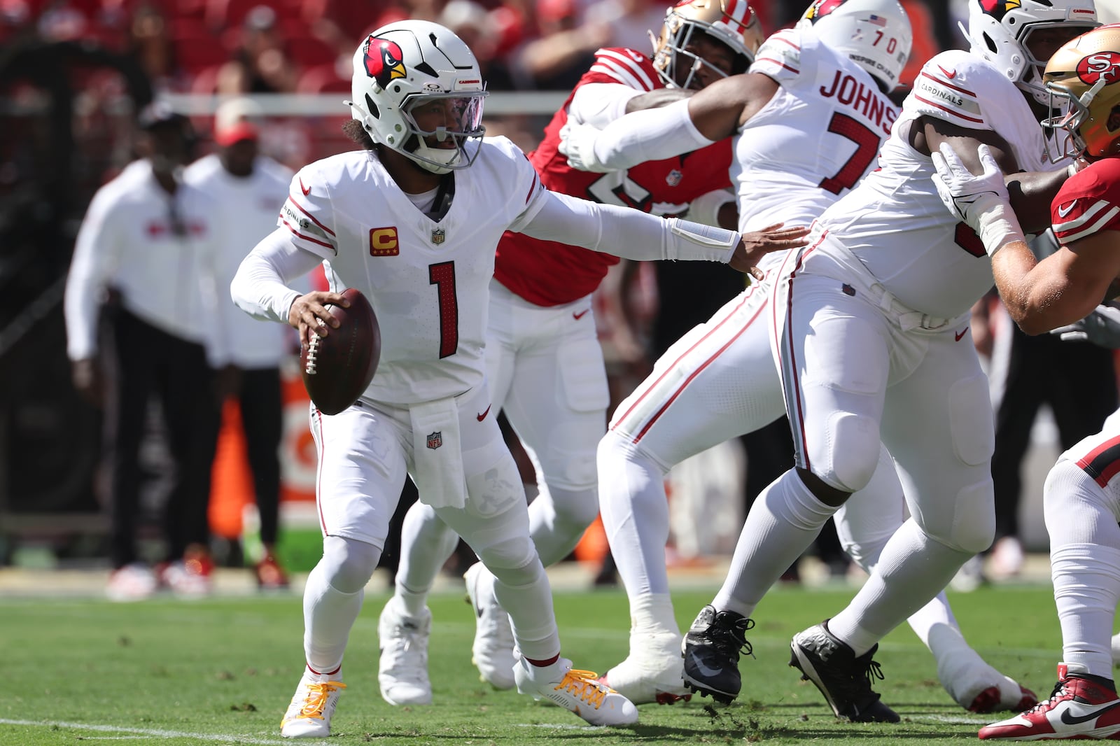 Arizona Cardinals quarterback Kyler Murray (1) scrambles out of the pocket during the first half of an NFL football game against the San Francisco 49ers in Santa Clara, Calif., Sunday, Oct. 6, 2024. (AP Photo/Jed Jacobsohn)