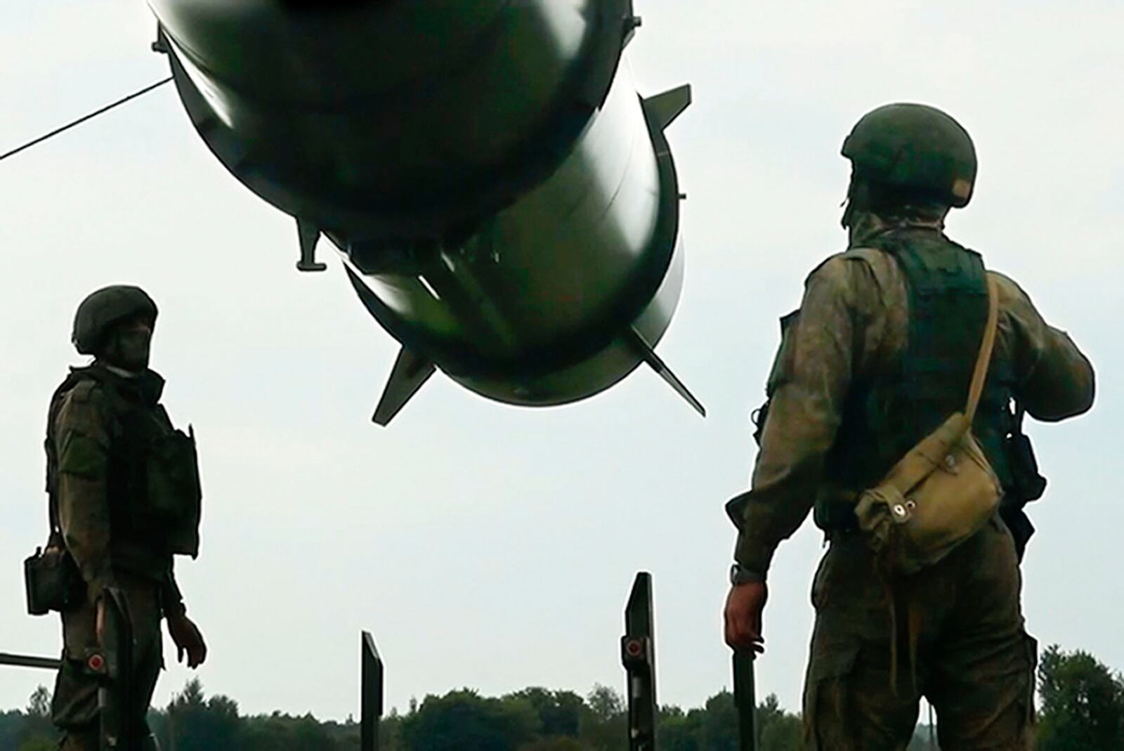 FILE - In this image taken form video released by the Russian Defense Ministry Press Service on June 12, 2024, Russian soldiers load an Iskander-M short-range ballistic missile launchers at a firing position as part of Russian military drill intended to train the troops in using tactical nuclear weapons. (Russian Defense Ministry Press Service via AP, File)