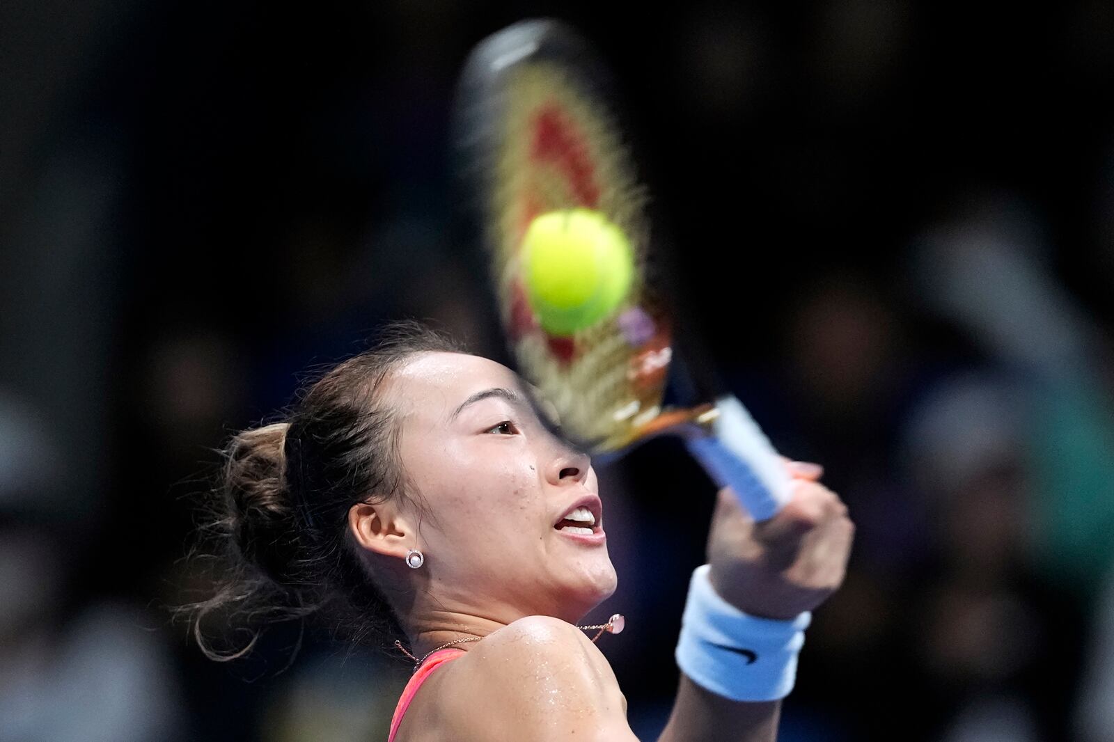 China's Zheng Qinwen returns a shot against Sofia Kenin of the United States during the final match of the Pan Pacific Open women's tennis tournament at Ariake Coliseum, in Tokyo, Sunday, Oct. 27, 2024. (AP Photo/Eugene Hoshiko)