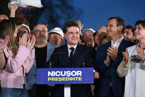 Presidential candidate Nicusor Dan smiles after polls closed for the first round of the country's presidential election redo in Bucharest, Romania, Sunday, May 4, 2025. (AP Photo/Eduard Vinatoru)