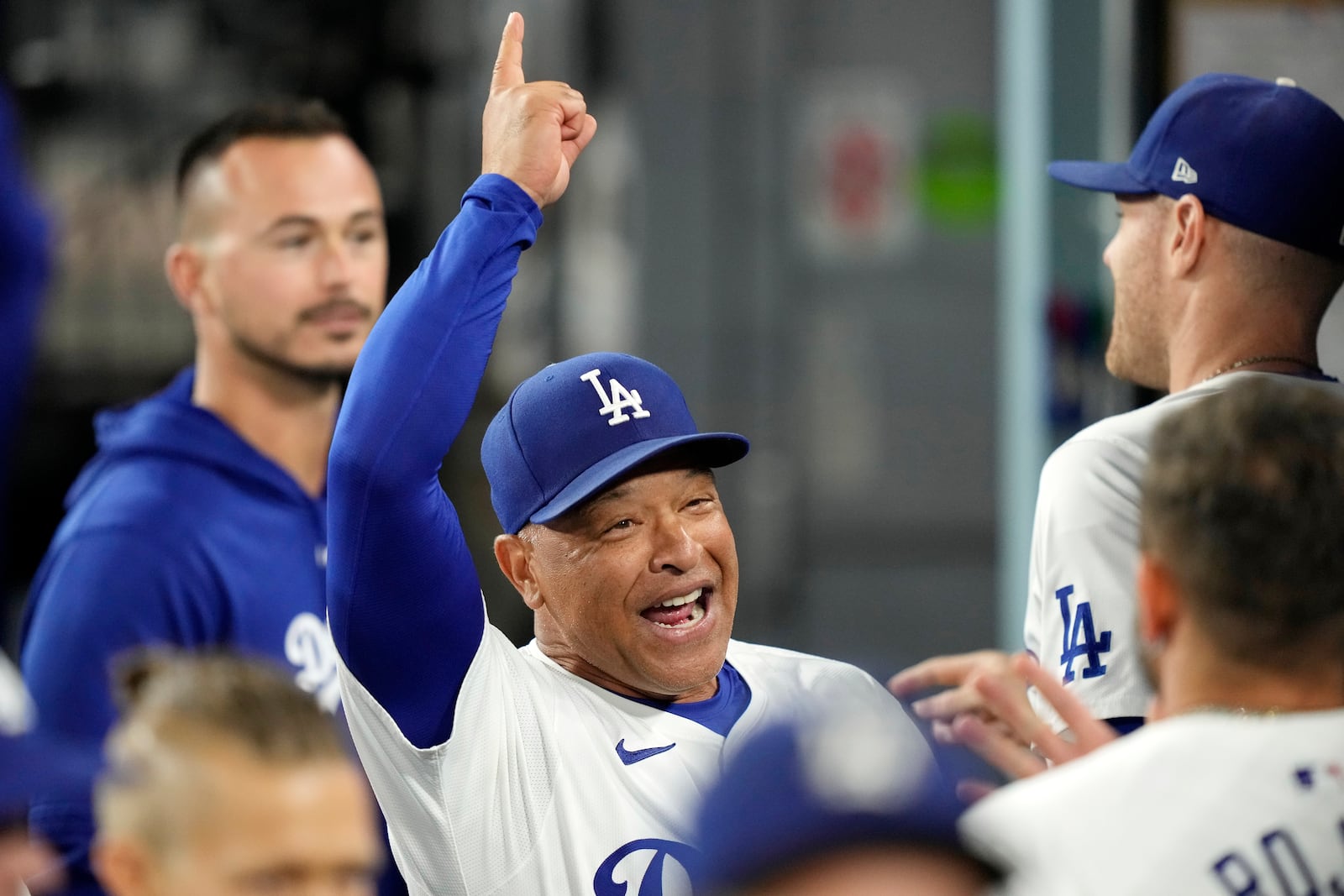 Los Angeles Dodgers manager Dave Roberts gestures to teammates prior to a baseball game against the San Diego Padres, Tuesday, Sept. 24, 2024, in Los Angeles. (AP Photo/Mark J. Terrill)