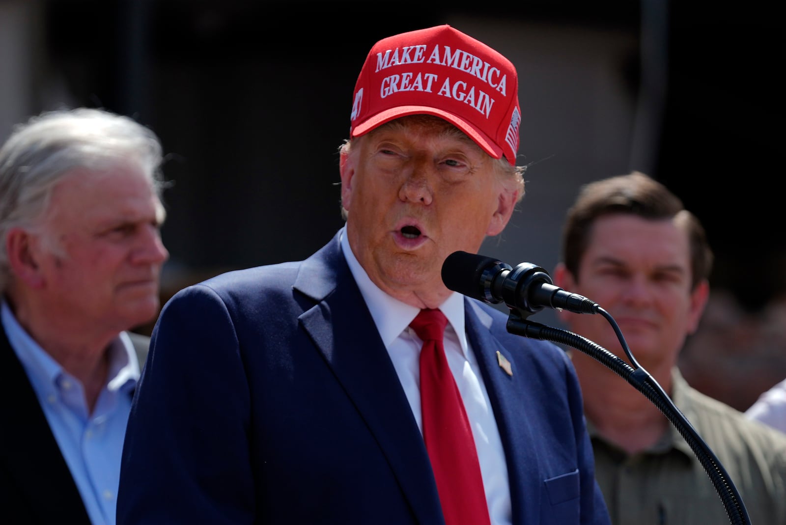 Republican presidential nominee former President Donald Trump speaks outside the Chez What furniture store as he visits Valdosta, Ga., a town impacted by Hurricane Helene, Monday, Sept. 30, 2024. (AP Photo/Evan Vucci)