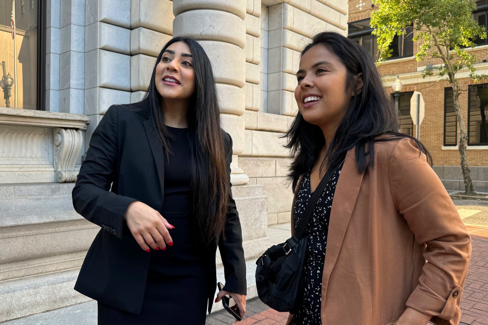 DACA-recipient María Rocha-Carrillo, 37, greets supporters outside federal appellate court in New Orleans on Thursday, Oct. 10, 2024. (AP Photo/Jack Brook)