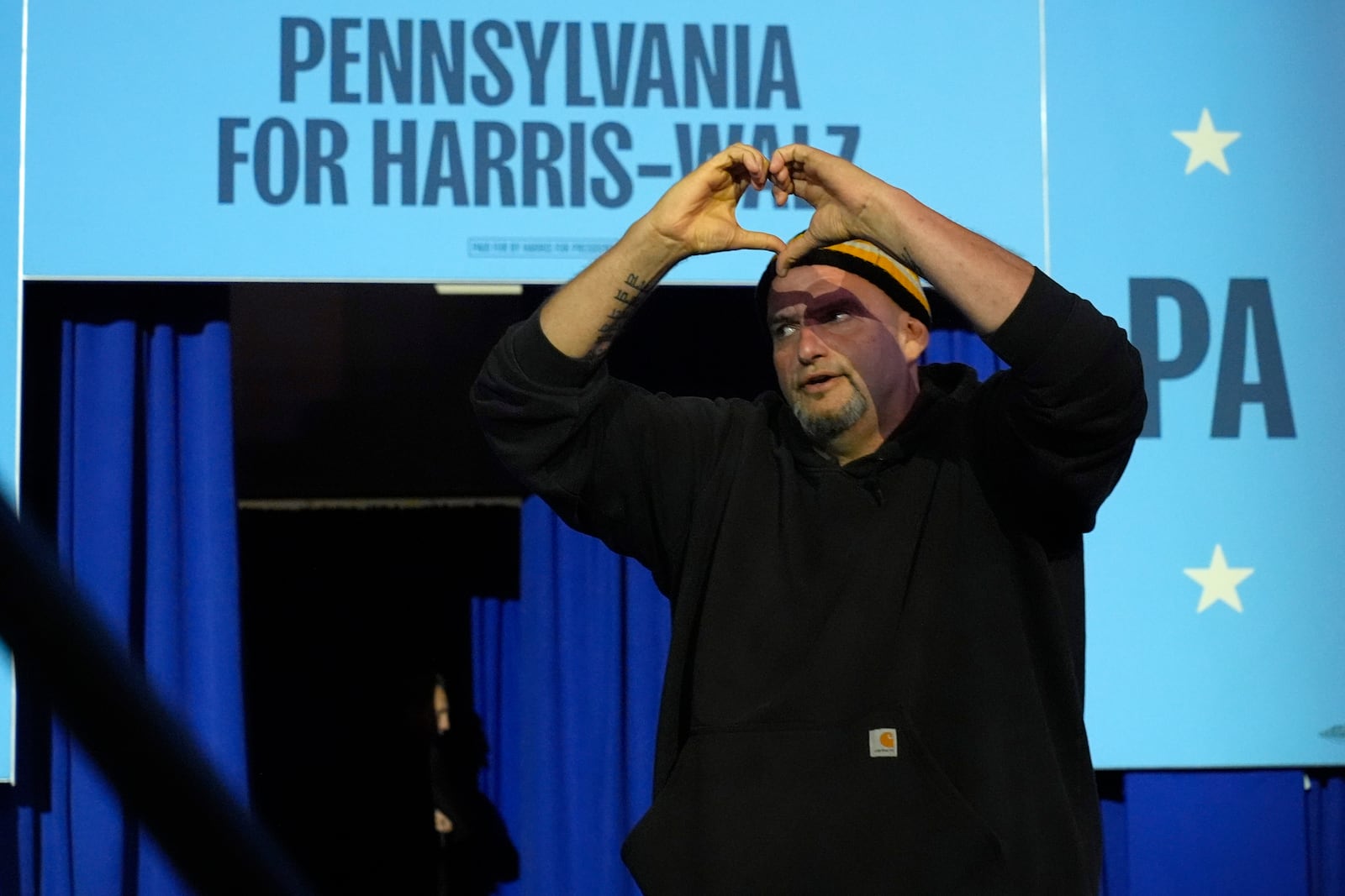 Sen. John Fetterman, D-Pa., arrives to speak at a campaign rally for Democratic presidential nominee Vice President Kamala Harris at Erie Insurance Arena, in Erie, Pa., Monday, Oct. 14, 2024. (AP Photo/Jacquelyn Martin)