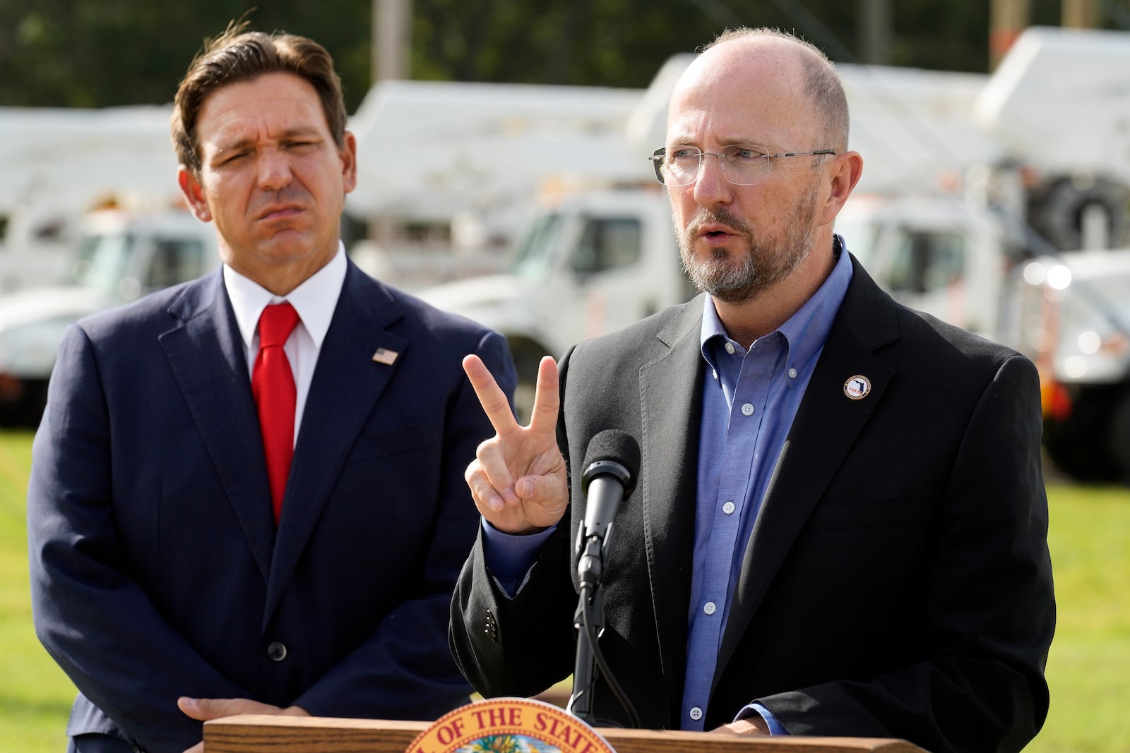 Kevin Guthrie, Director of Florida Division of Emergency Management, right, gestures as Gov. Ron DeSantis looks on during a news conference, Wednesday, Sept. 25, 2024, at the Tampa Electric Company offices in Tampa, Fla., as Tropical Storm Helene, expected to become a hurricane, moves north along Mexico’s coast toward the U.S. (AP Photo/Chris O'Meara)