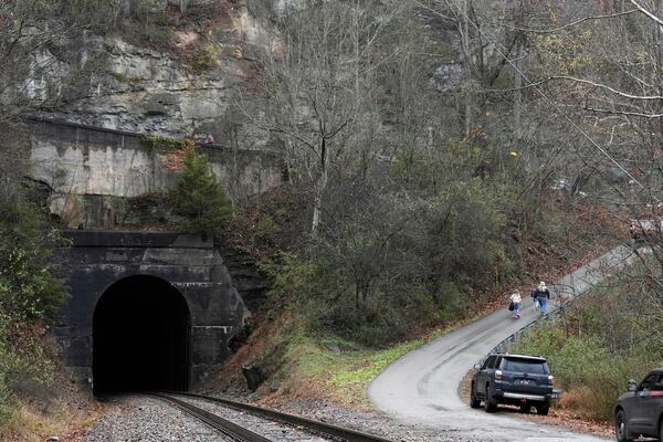 People leave after a visit of the CSX Santa Train, Saturday, Nov. 23, 2024, in Haysi, Va. The train brings presents to small towns along a 110-mile portion of the railroad line in rural Appalachian Tennessee, Kentucky and Virginia. (AP Photo/George Walker IV)