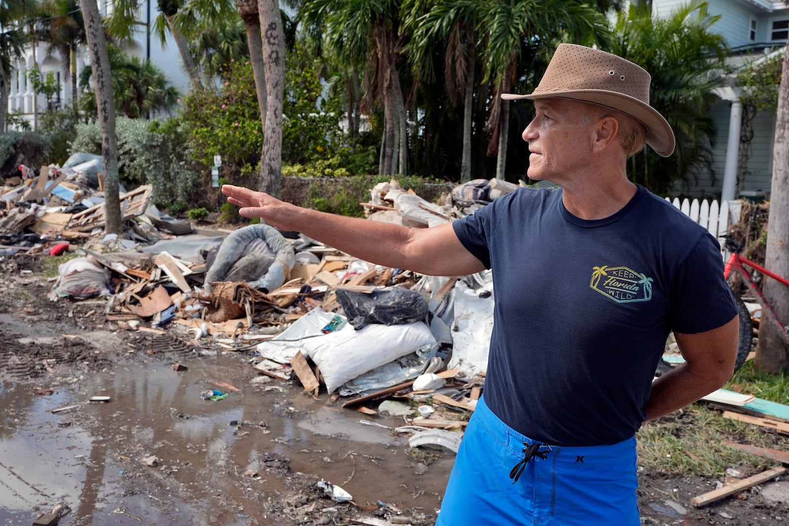 Arnie Bellini surveys the damages caused from Hurricane Helene on a street in Clearwater Beach, Fla., Tuesday, Oct. 8, 2024. Bellini fronted $500,000. of his own money to help speed up debris cleanup ahead of the possible arrival of Hurricane Milton. (AP Photo/Chris O'Meara)