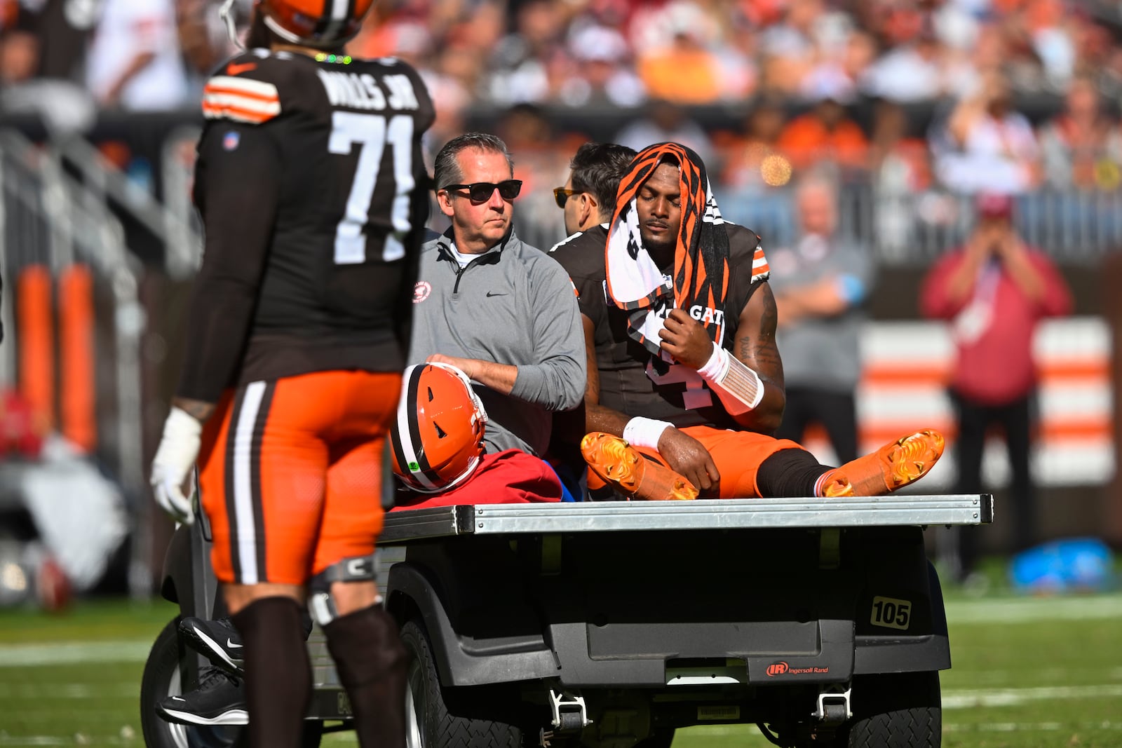 Cleveland Browns quarterback Deshaun Watson (4) is carted off the field after being injured in the first half of an NFL football game against the Cincinnati Bengals, Sunday, Oct. 20, 2024, in Cleveland. (AP Photo/David Richard)