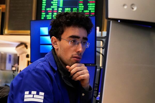 Specialist Alex Weitzman works at his post on the floor of the New York Stock Exchange, Friday, May 2, 2025. (AP Photo/Richard Drew)