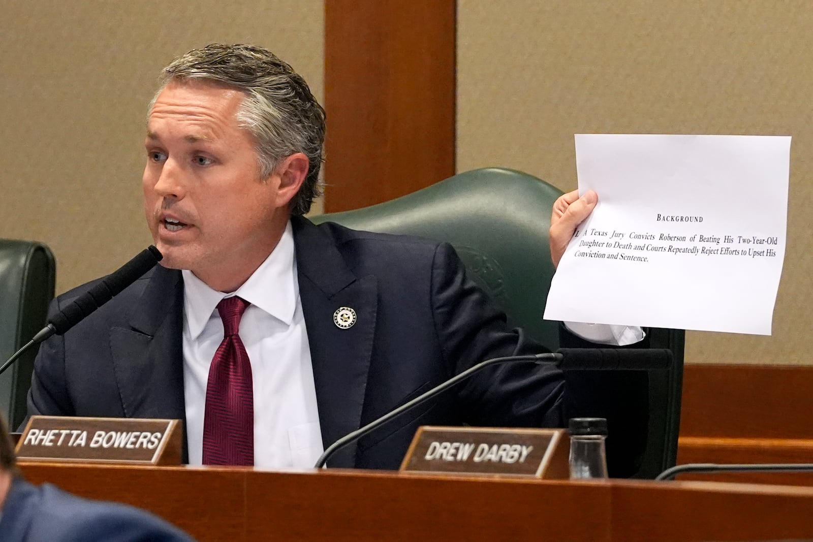 State Rep. Brian Harrison, R-Midlothian, holds a statement as he questions a witness during the committee hearing regarding the death row case of Robert Roberson, Monday, Oct. 21, 2024, in Austin, Texas. (AP Photo/Tony Gutierrez)