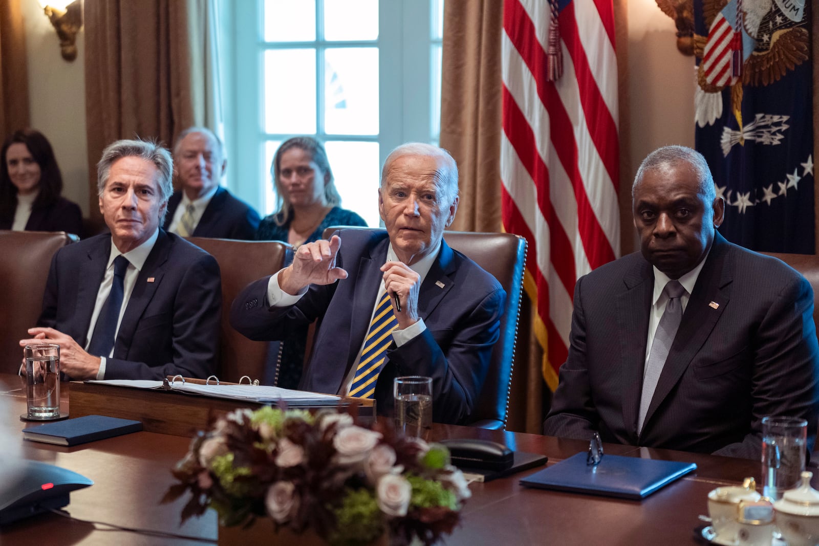 President Joe Biden flanked Secretary of State Antony Blinken, left, and Secretary of Defense Lloyd Austin, right, speaks during a meeting with the members of his cabinet and first lady Jill Biden, in the Cabinet Room of the White House, Friday, Sept. 20, 2024. (AP Photo/Manuel Balce Ceneta)