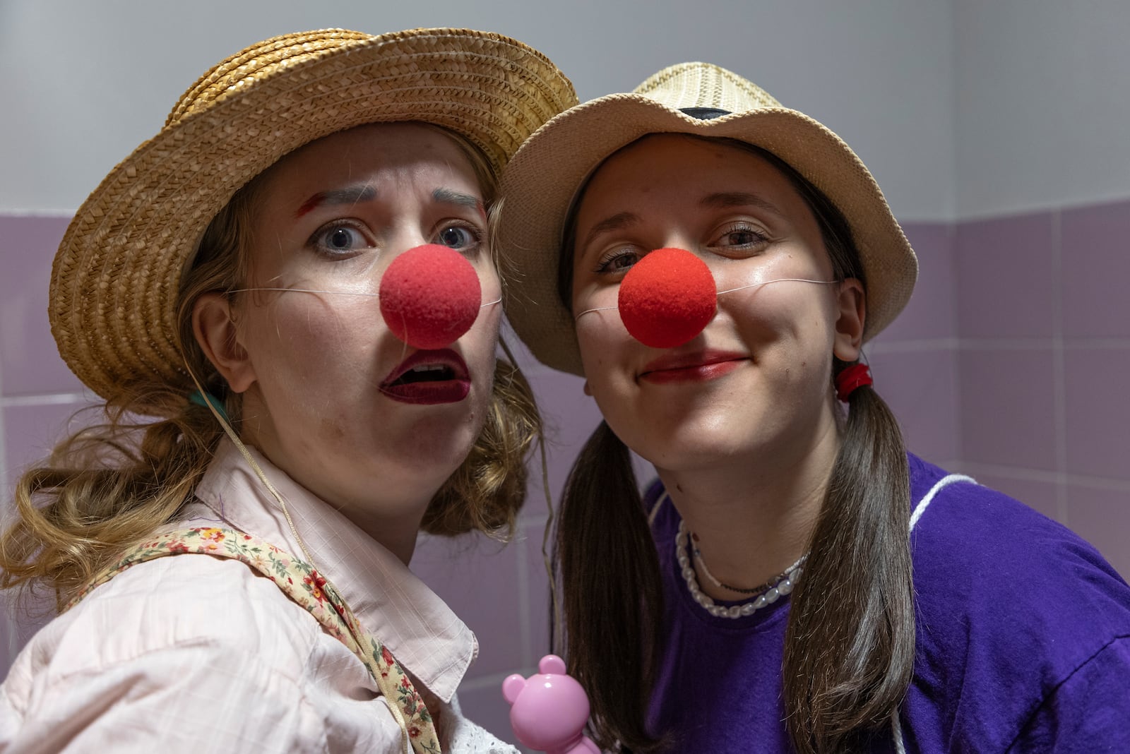 Vladyslava Kulinich, right, Tetiana Nosova, who have the clown names Lala and Zhuzha, pose for a photo as they prepare to perform at Okhmatdyt children's hospital in Kyiv, Ukraine, Thursday Sept. 19, 2024. (AP Photo/Anton Shtuka)