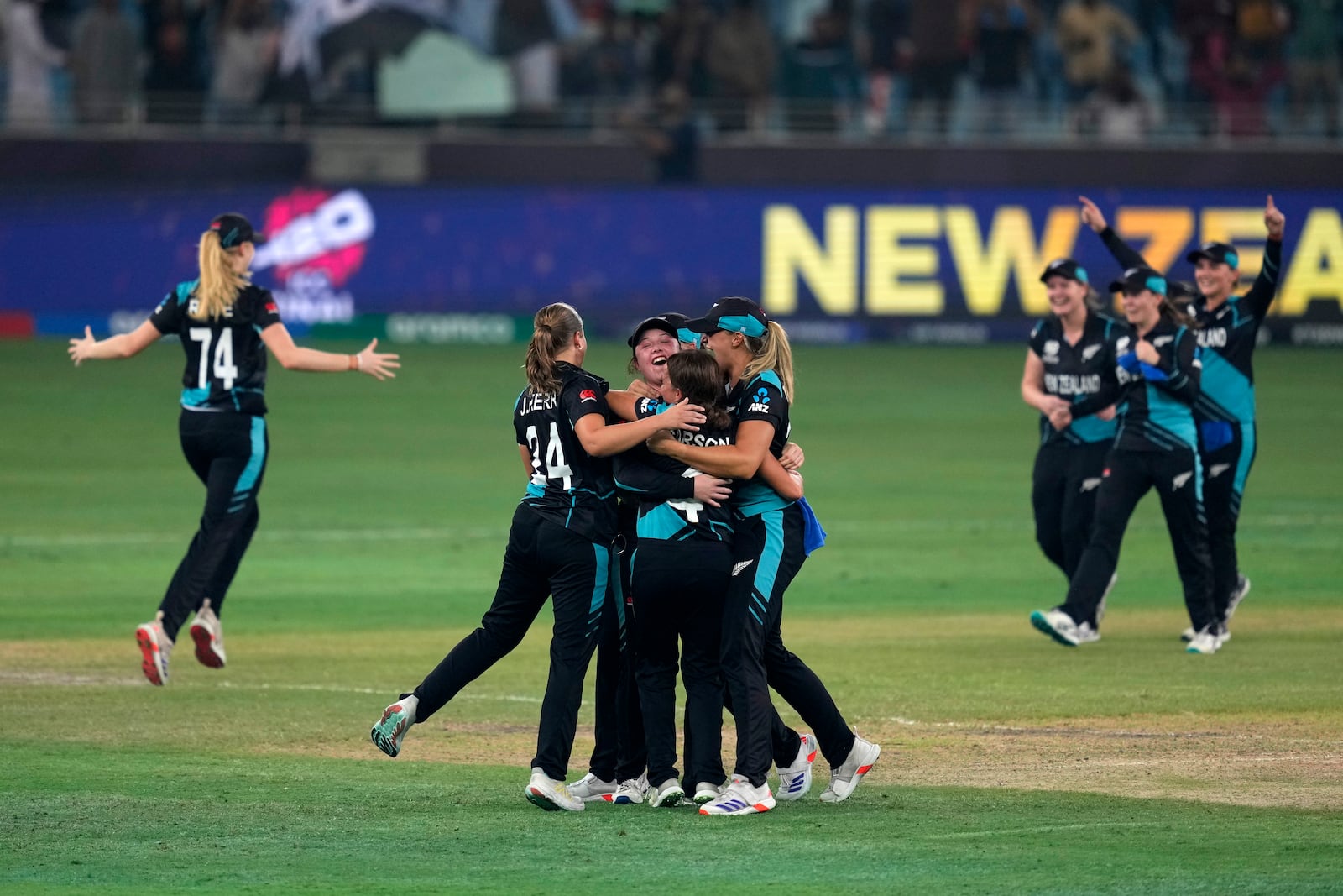 New Zealand's players celebrate after winning the ICC Women's T20 World Cup 2024 final match against South Africa at Dubai, United Arab Emirates, Sunday, Oct. 20, 2024. (AP Photo/Altaf Qadri)