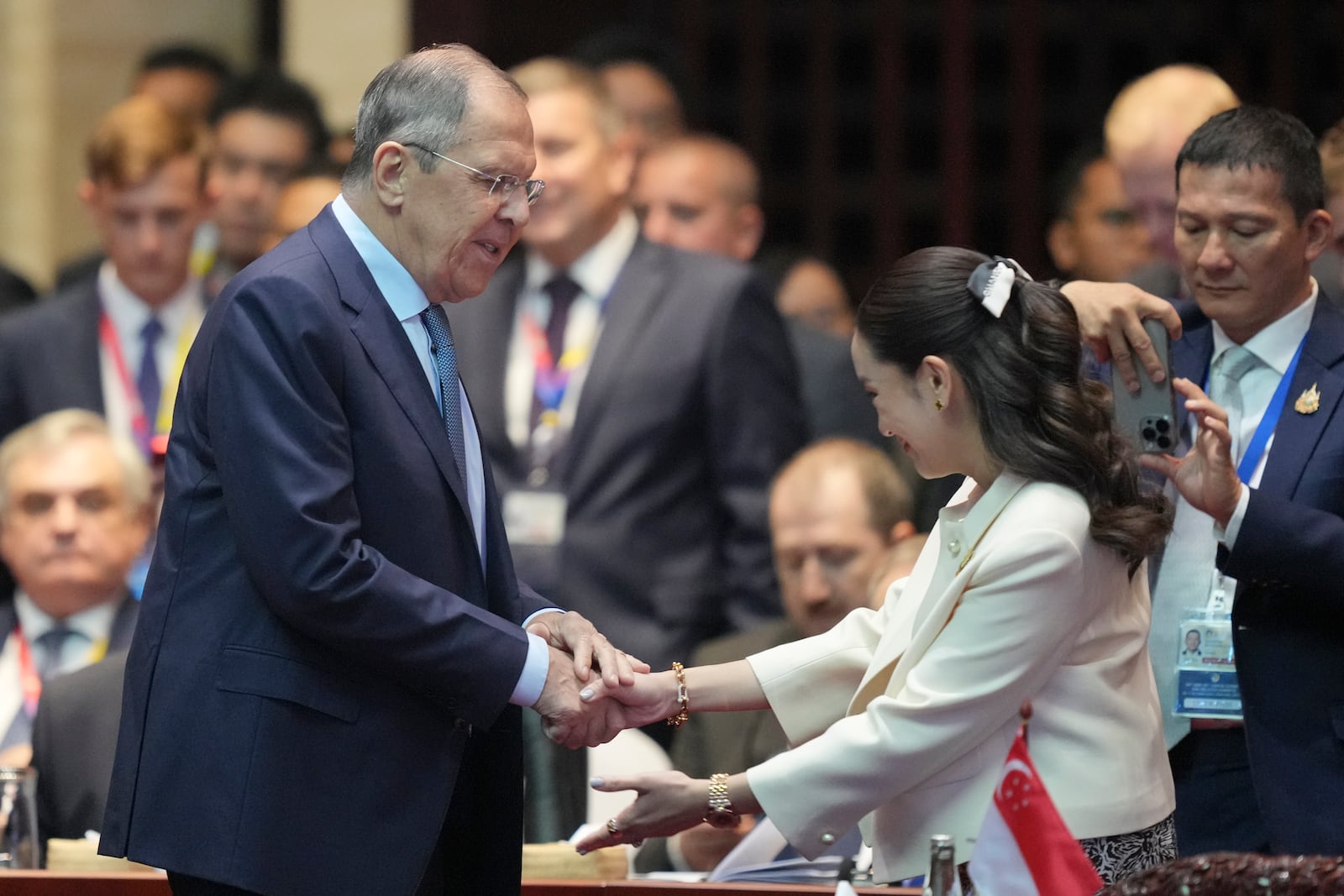 Russian Foreign Minister Sergey Lavrov, left, shakes hands with Thailand's Prime Minister Paetongtarn Shinawatra during the 19th East Asia Summit in Vientiane, Laos, Friday, Oct. 11, 2024. (AP Photo/Dita Alangkara)