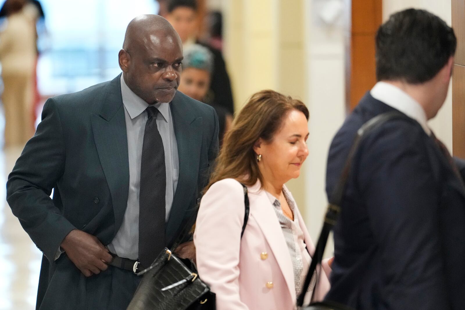 Former Houston police officer Gerald Goines, left, and his defense attorney Nicole DeBorde Hochglaube arrive to the 482nd District Court to await a verdict in his murder trial at the Harris County Criminal courthouse Wednesday, Sept. 25, 2024, in Houston. Goines faces two felony murder charges in the January 2019 deaths of Dennis Tuttle and Rhogena Nicholas. (Melissa Phillip/Houston Chronicle via AP)