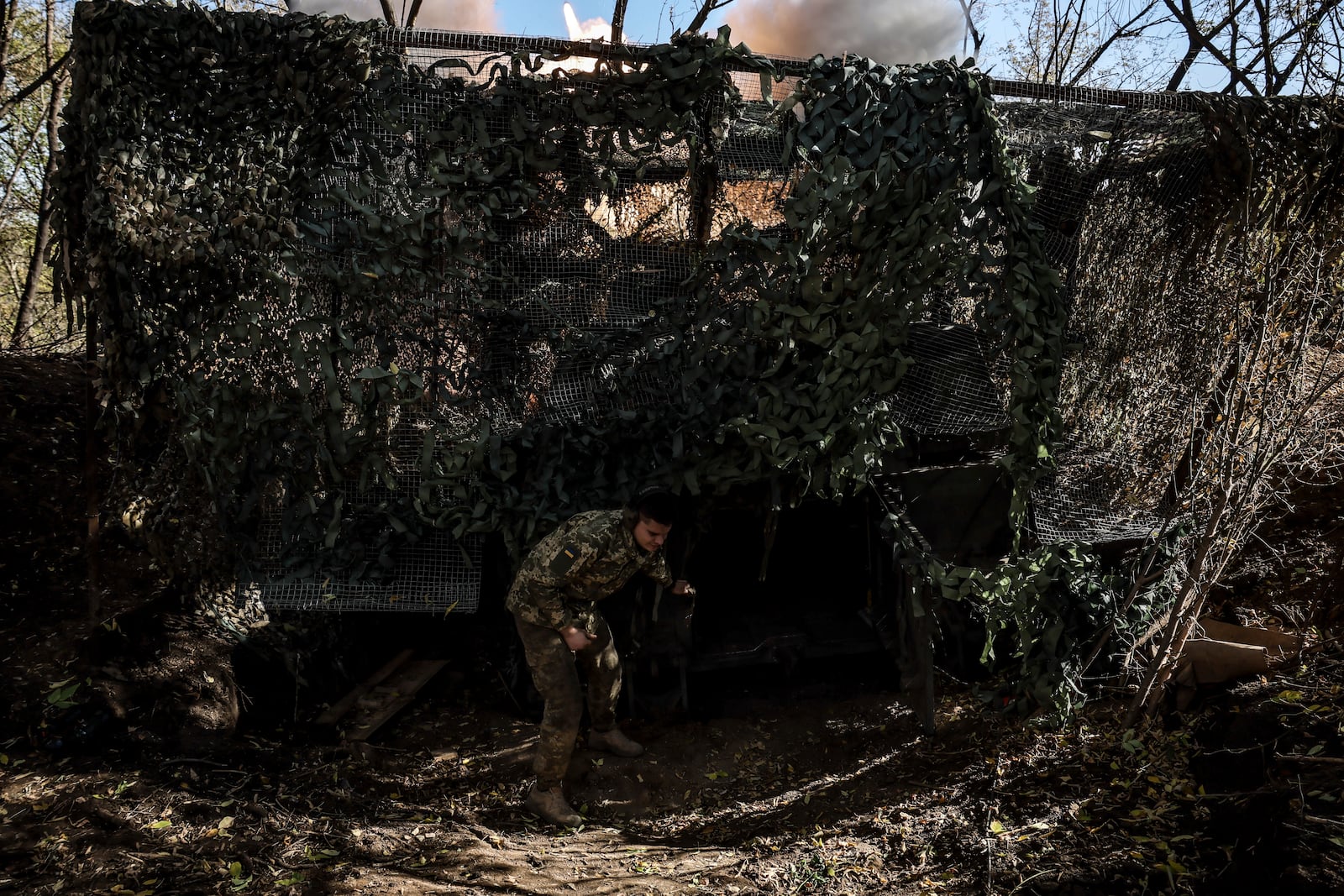 In this photo provided by Ukraine's 24th Mechanised Brigade press service, servicemen of the 24th Mechanised Brigade fire 155mm M-109 "Paladin" howitzer towards Russian forces near the frontline town of Chasiv Yar, Donetsk region, Ukraine, Wednesday, Oct. 23, 2024. (Oleg Petrasiuk/Ukrainian 24th Mechanised Brigade via AP)