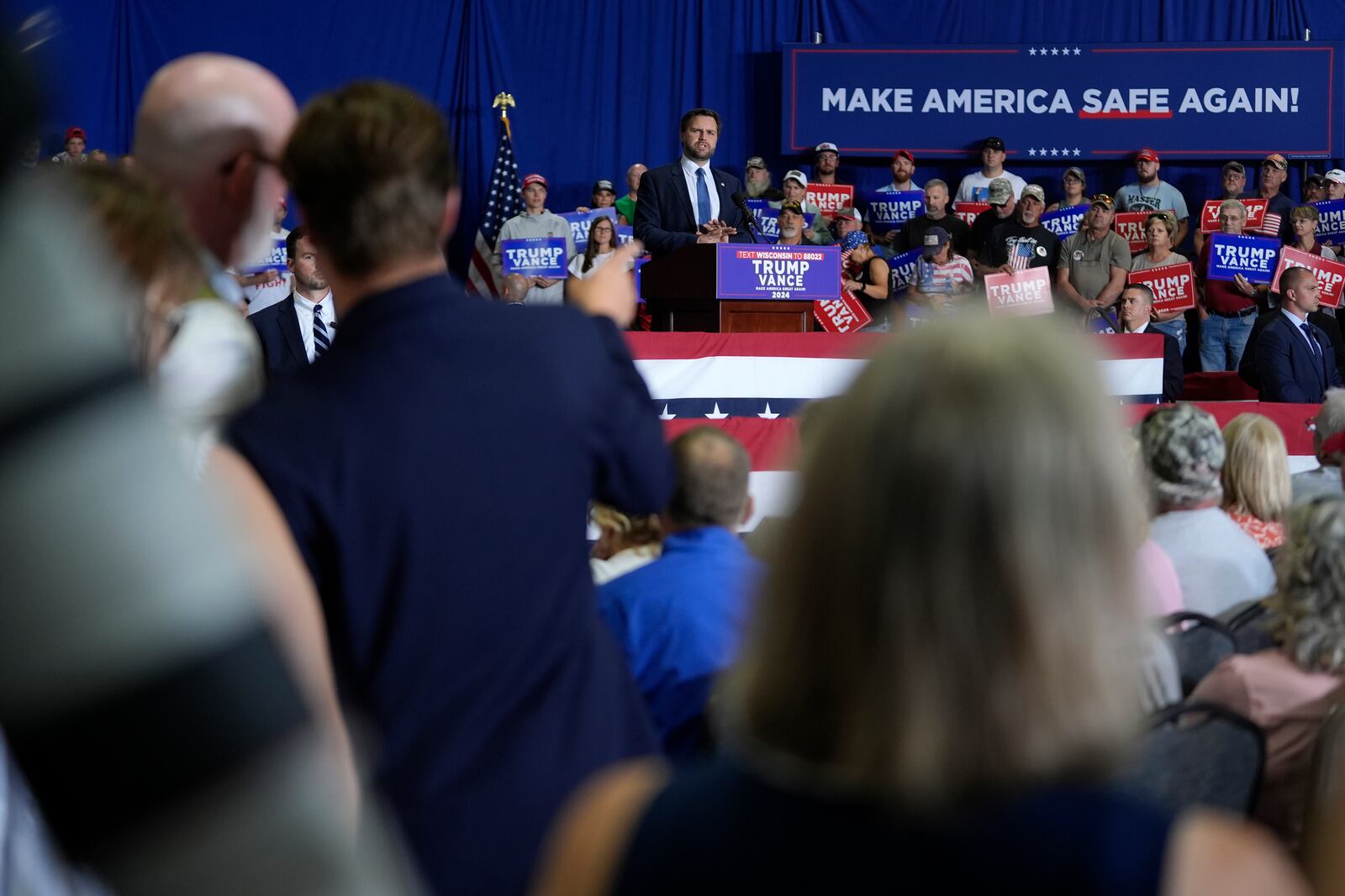 Republican vice presidential nominee Sen. JD Vance, R-Ohio, back, center, speaks at a campaign event, Tuesday, Sept. 17, 2024 in Eau Claire, Wis. (AP Photo/Abbie Parr)