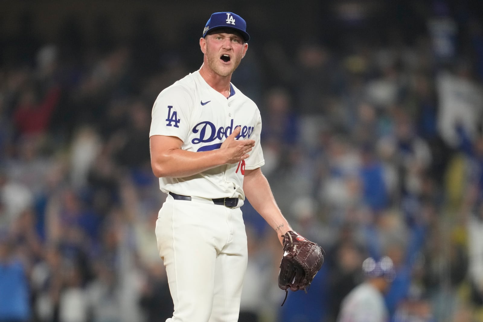 Los Angeles Dodgers relief pitcher Ben Casparius celebrates after their win against the New York Mets in Game 1 of a baseball NL Championship Series, Sunday, Oct. 13, 2024, in Los Angeles. (AP Photo/Ashley Landis)