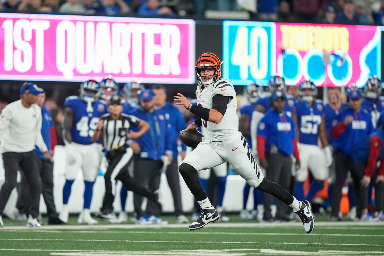 Cincinnati Bengals quarterback Joe Burrow runs for a touchdown during the first half of an NFL football game against the New York Giants, Sunday, Oct. 13, 2024, in East Rutherford, N.J. (AP Photo/Frank Franklin II)