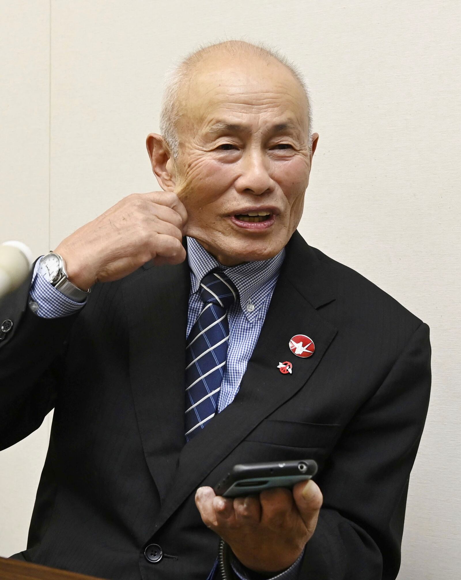 Toshiyuki Mimaki, president of Nihon Hidankyo, or the Japan Confederation of A- and H-Bomb Sufferers Organizations, reacts as he speaks to media members in Hiroshima, western Japan, Friday, Oct. 11, 2024, following Nihon Hidankyo's winning the Nobel Peace Prize. (Moe Sasaki/Kyodo News via AP)