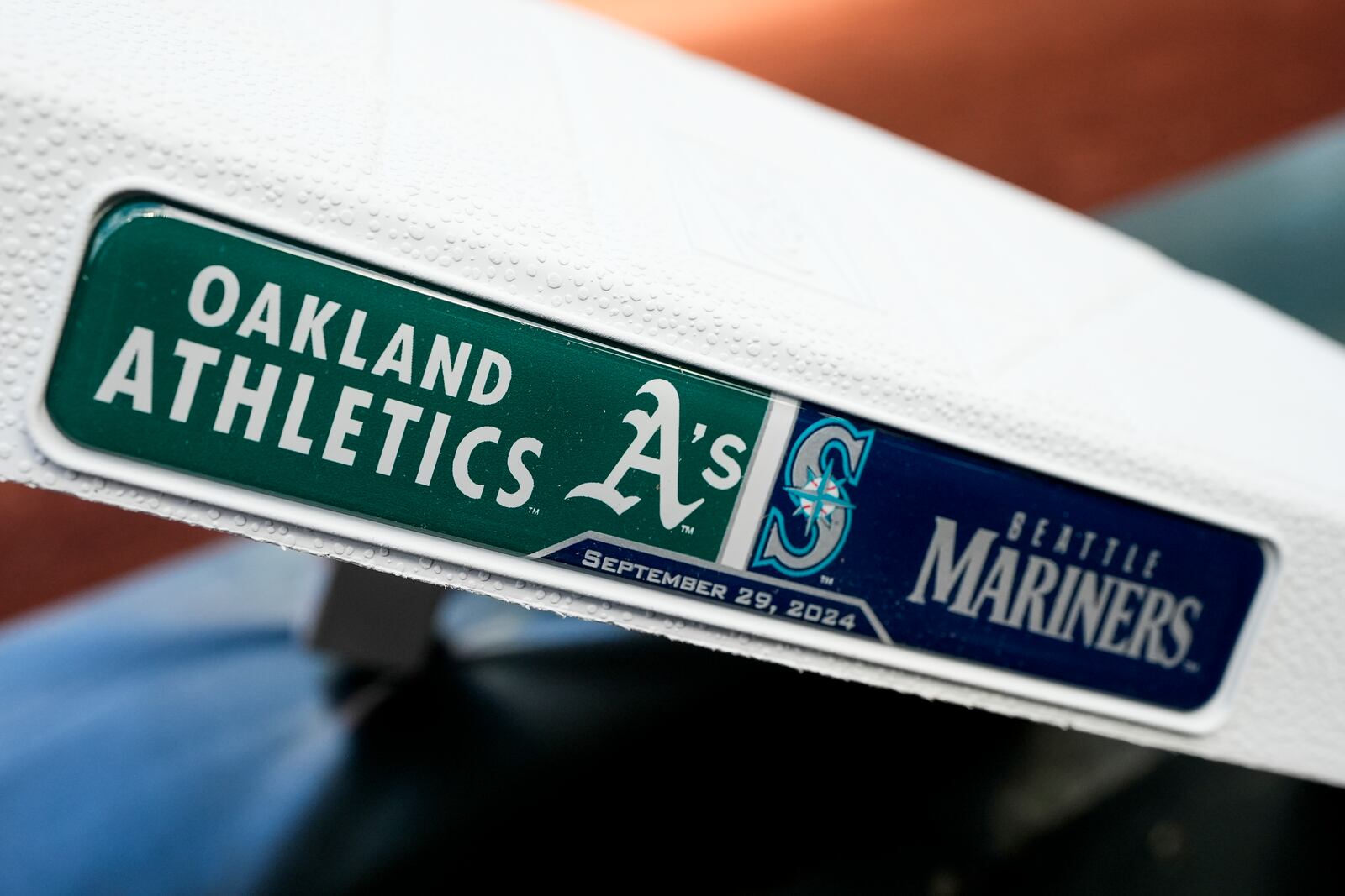 A base showing the Oakland Athletics and the Seattle Mariners logos is seen before a baseball game, Sunday, Sept. 29, 2024, in Seattle. (AP Photo/Lindsey Wasson)