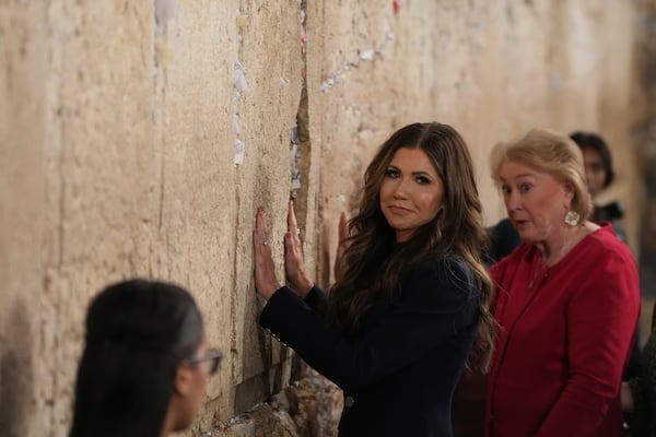 Homeland Security Secretary Kristi Noem visits the Western Wall, the holiest site where Jews can pray, in the Old City of Jerusalem, Sunday, May 25, 2025. (AP Photo/Ohad Zwigenberg)