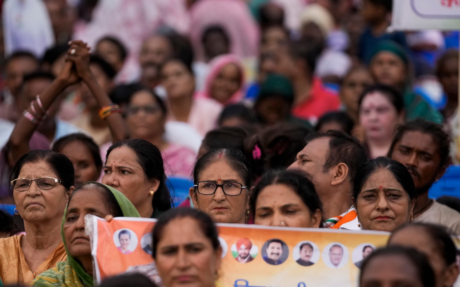 Supporters of Congress party listen as their leader Rahul Gandhi speaks during a campaign rally of Jammu and Kashmir Assembly elections in Jammu, India, Wednesday, Sept.25, 2024.(AP Photo/Channi Anand)