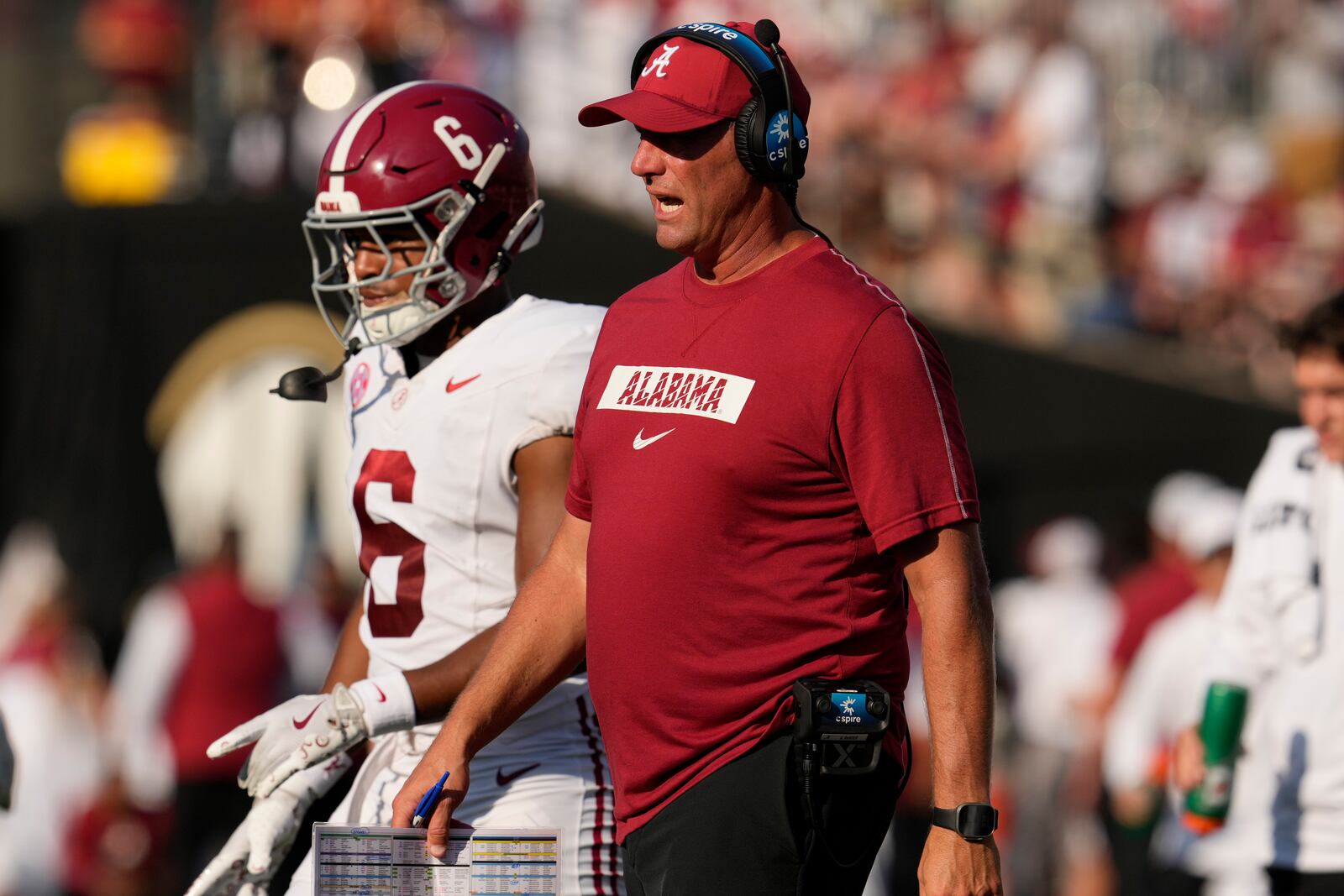 Alabama head coach Kalen DeBoer, right, walks onto field during the first half of an NCAA college football game against Vanderbilt, Saturday, Oct. 5, 2024, in Nashville, Tenn. (AP Photo/George Walker IV)