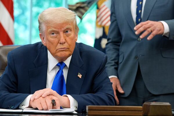 President Donald Trump listens as Health and Human Services Secretary Robert F. Kennedy Jr. speaks as he signs executive orders and proclamations in the Oval Office of the White House, Monday, May 5, 2025, in Washington. (AP Photo/Alex Brandon)