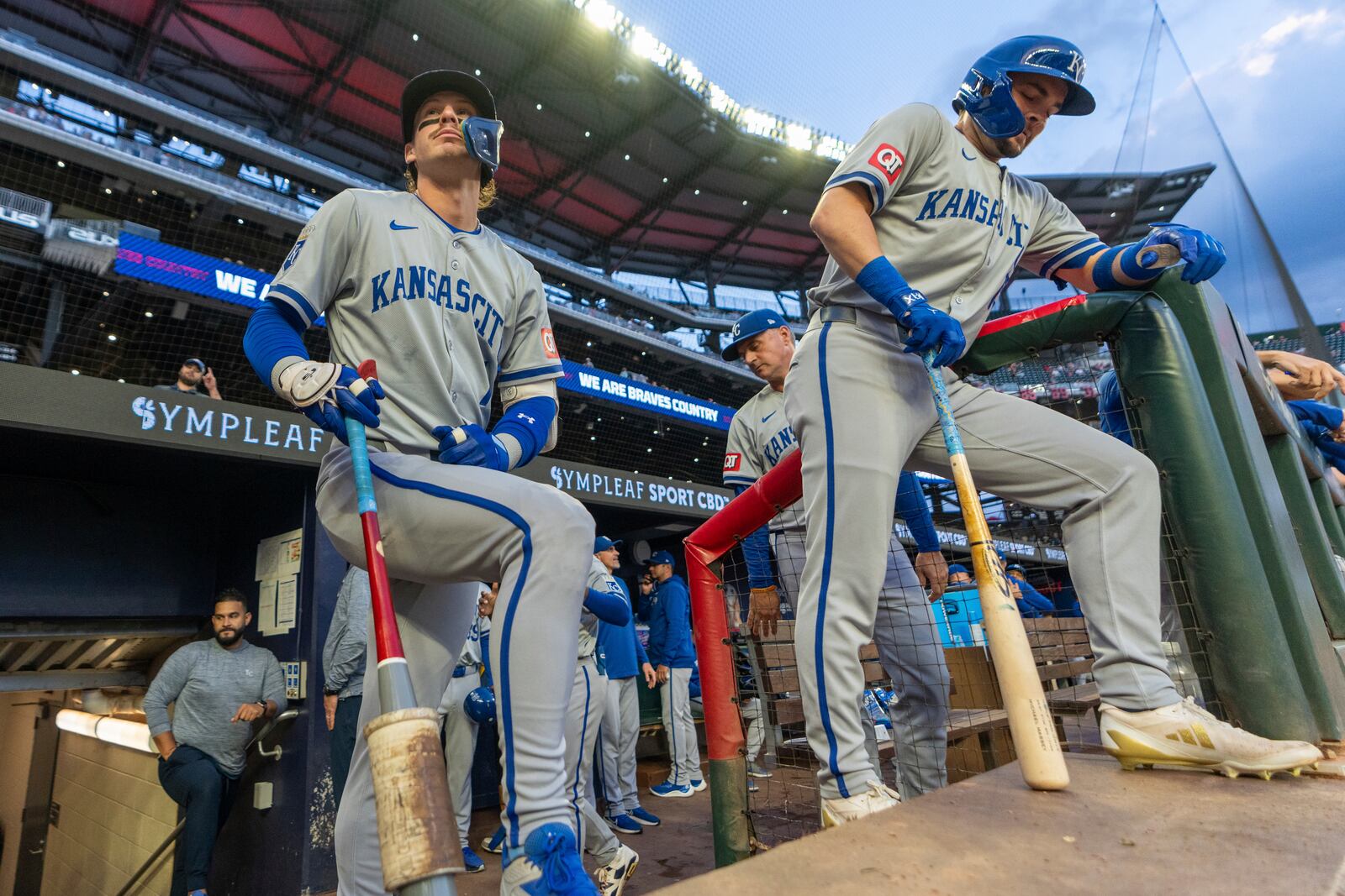 Kansas City Royals' Bobby Witt Jr., lfront eft, and Michael Massey, right, await for their turns at bat in the first inning of a baseball game against the Atlanta Braves, Friday, Sept. 27, 2024, in Atlanta. (AP Photo/Jason Allen)