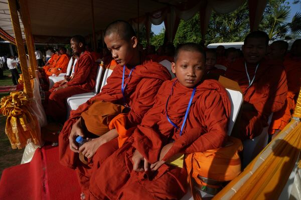 Cambodian Buddhist monks attend a ceremony during an annual ceremony of Remembrance Day at Choeung Ek, a former Khmer Rouge "killing field," on the outskirt of Phnom Penh, Cambodia Tuesday, May 20, 2025. (AP Photo/Heng Sinith)