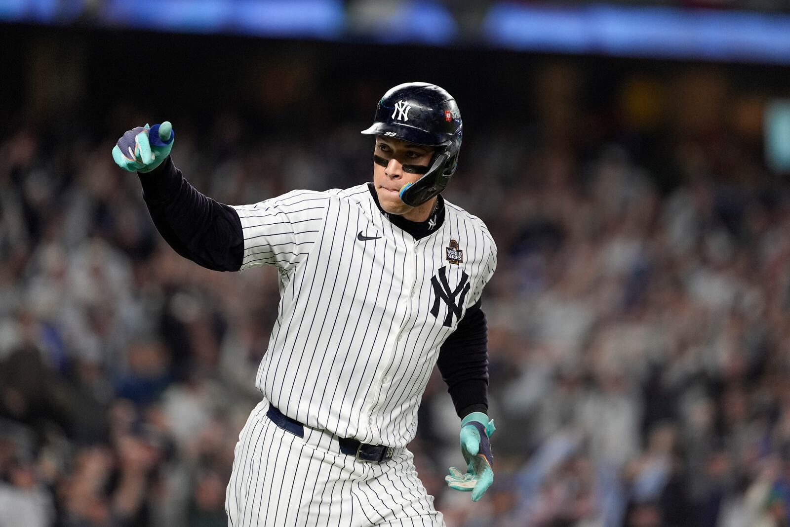 New York Yankees' Aaron Judge celebrates after hitting a two-run home run against the Los Angeles Dodgers during the first inning in Game 5 of the baseball World Series, Wednesday, Oct. 30, 2024, in New York. (AP Photo/Godofredo A. Vásquez)