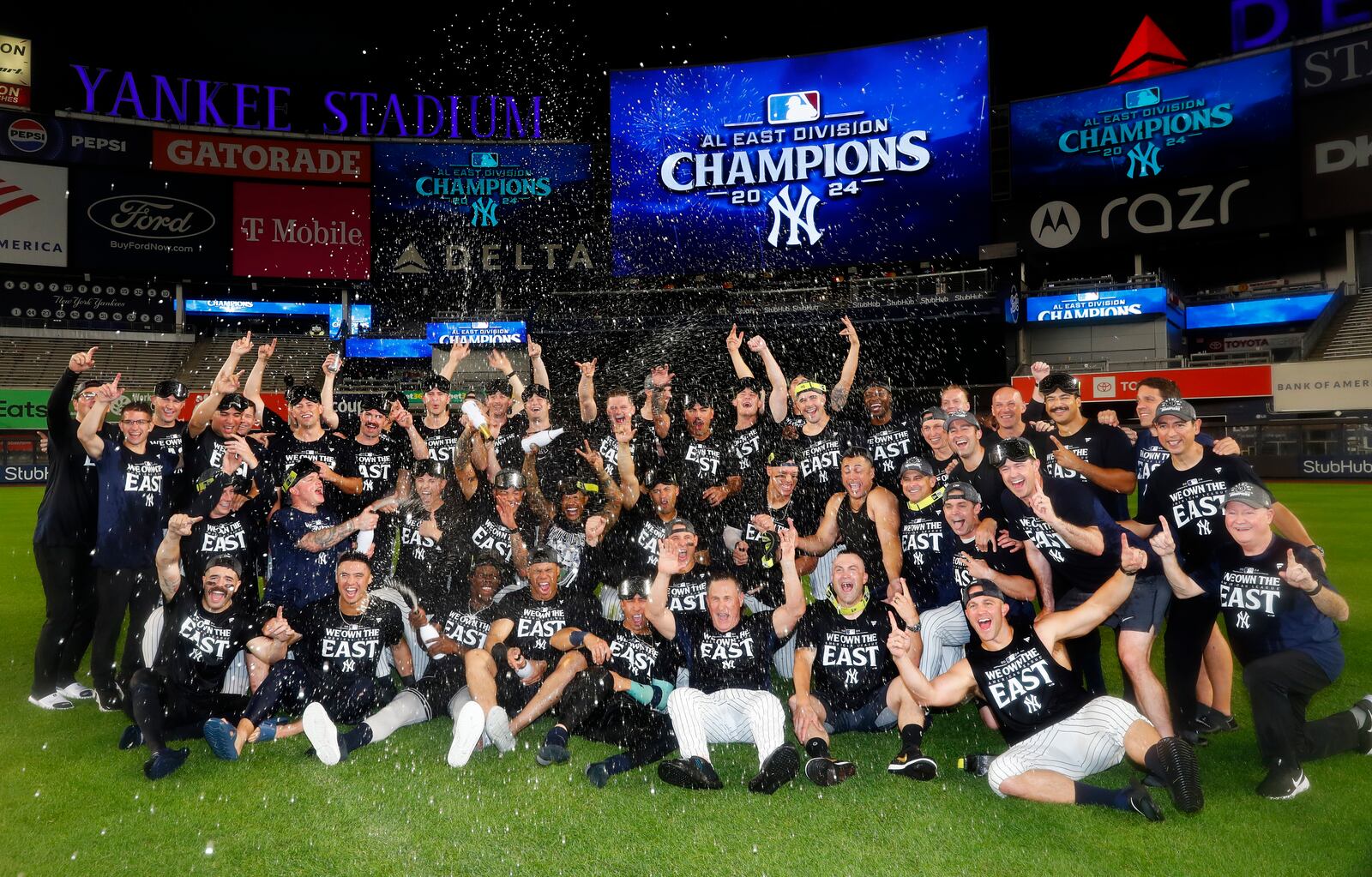 The New York Yankees celebrate after clinching the American League East title in a baseball game against the Baltimore Orioles, Thursday, Sept. 26, 2024, in New York. (AP Photo/Noah K. Murray)