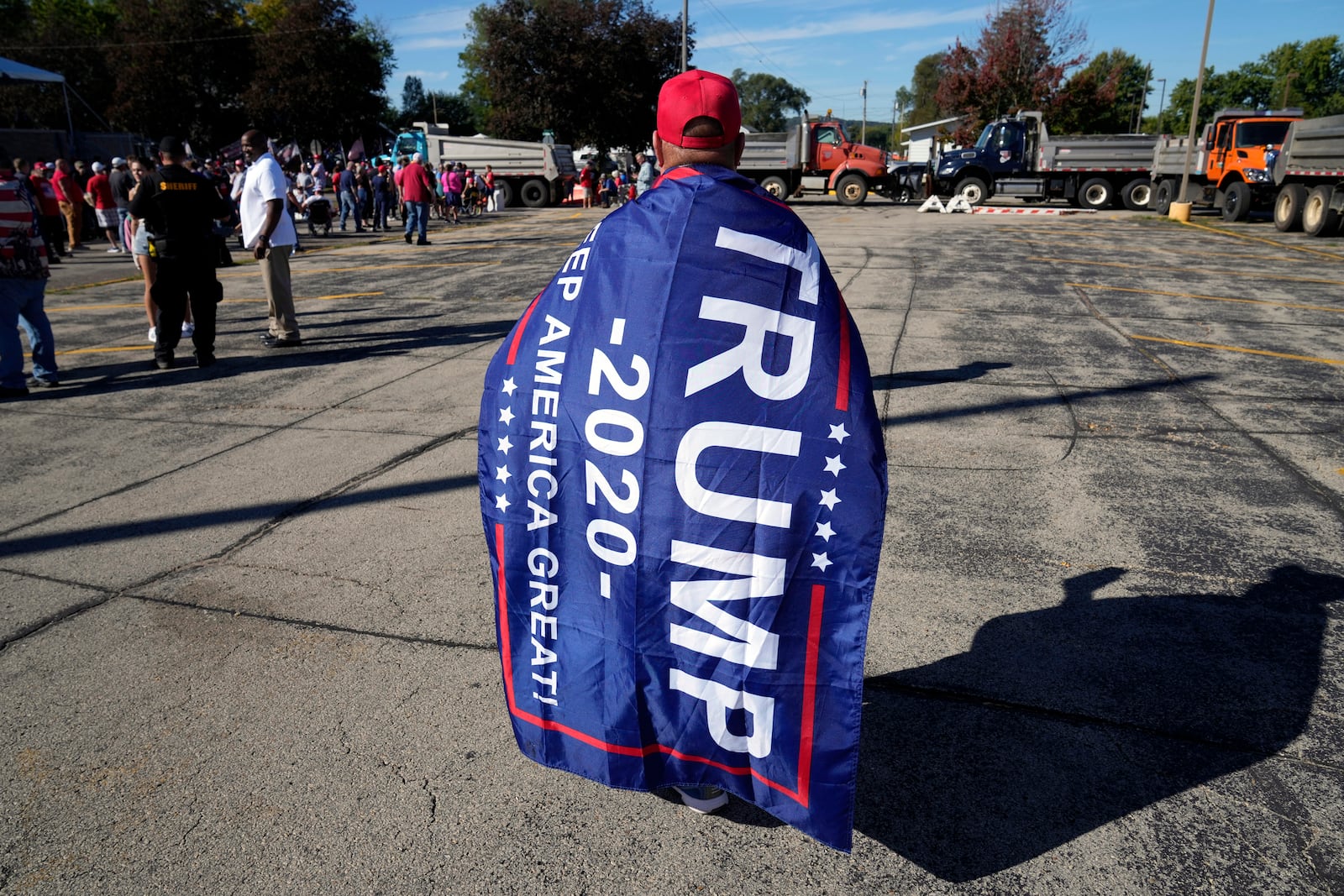 A supporter waits for Republican presidential nominee former President Donald Trump to arrive at a rally, Saturday, Sept. 28, 2024, in Prairie du Chien, Wis. (AP Photo/Charlie Neibergall)