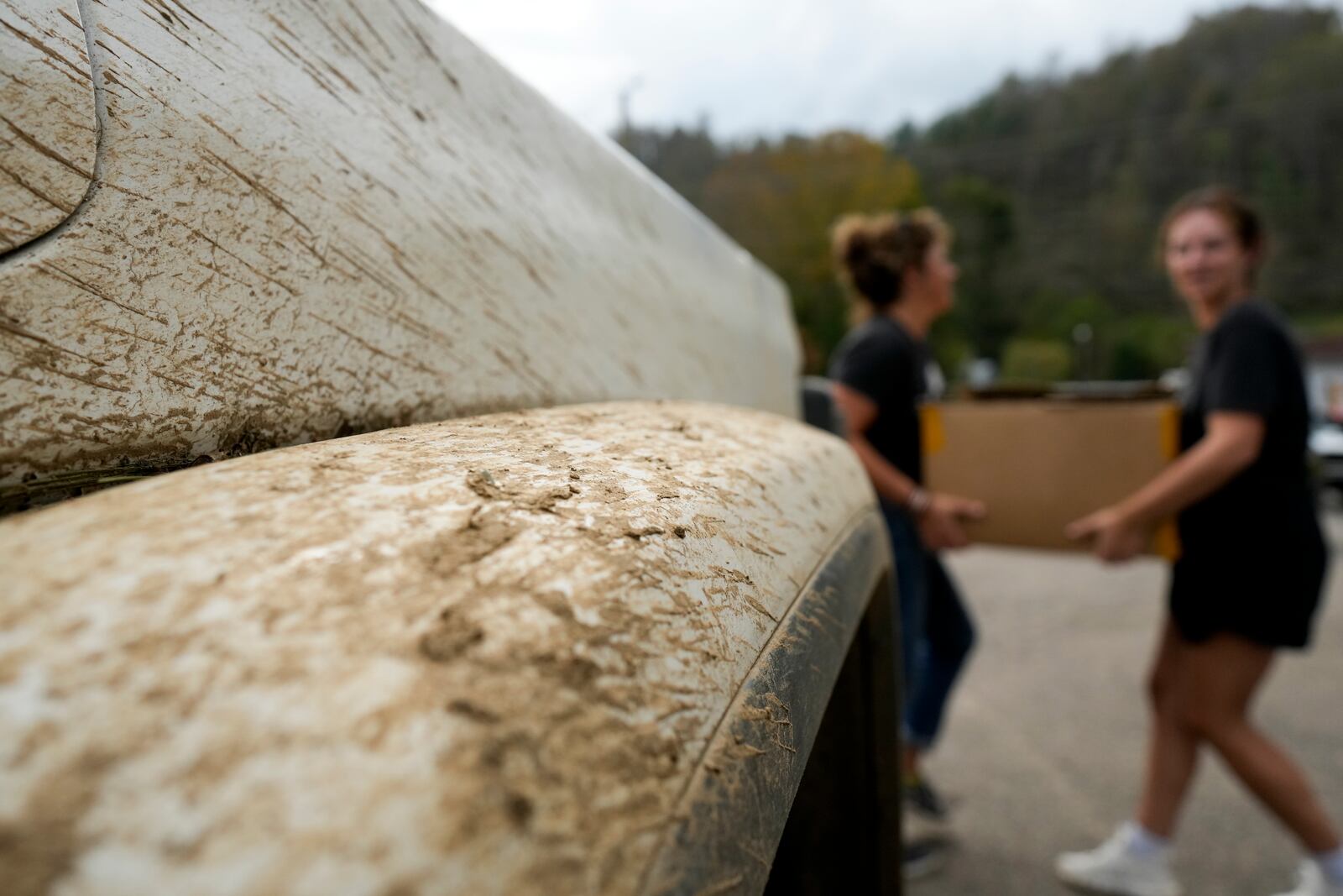 Volunteers unload supplies at a relief center on Thursday, Oct. 3, 2024, in Vilas, N.C. in the aftermath of hurricane Helene. In the final weeks of the presidential election, people in North Carolina and Georgia, influential swing states, are dealing with more immediate concerns: recovering from Hurricane Helene. (AP Photo/Chris Carlson)