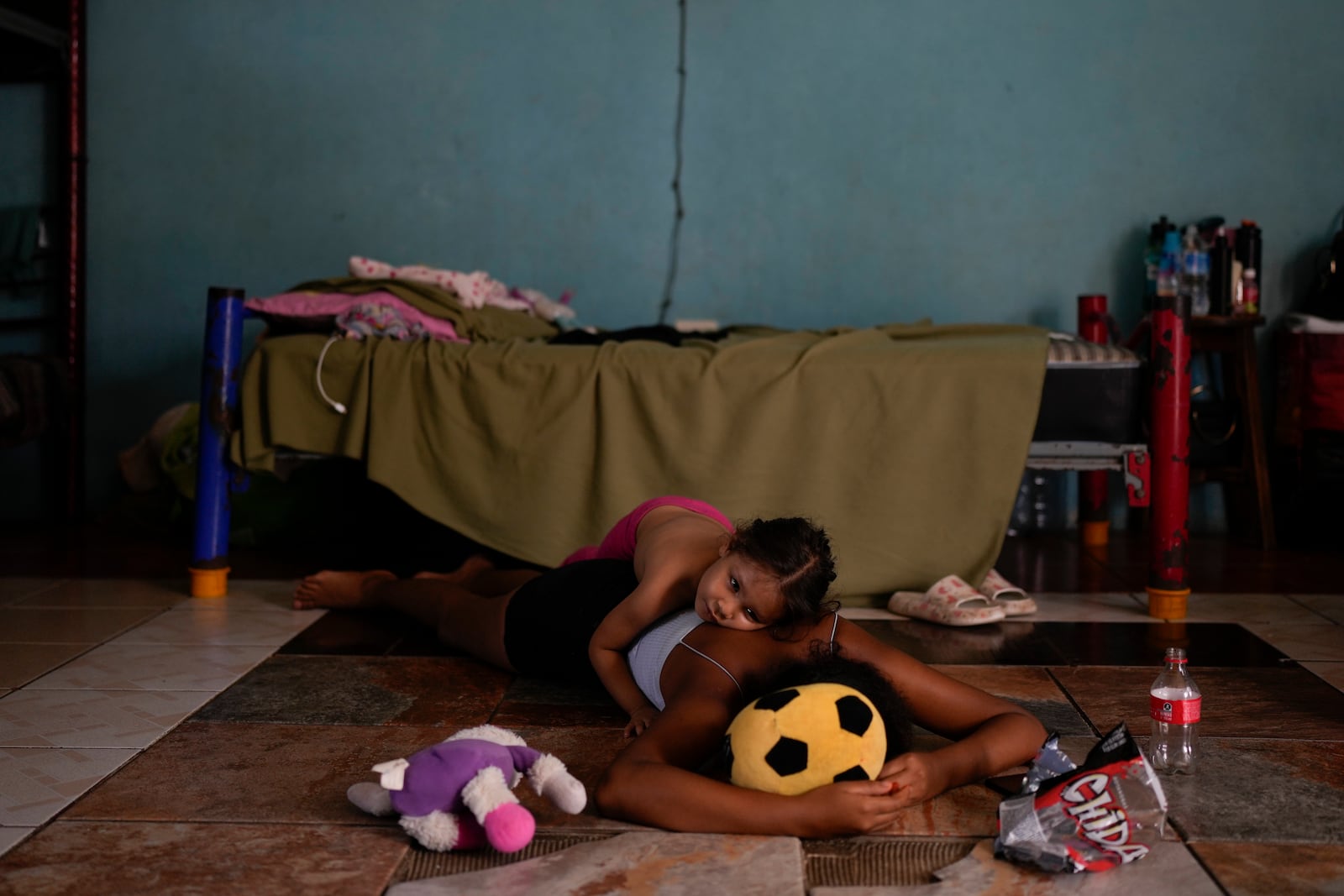 Honduran migrant Mayra Torres hugs her sister in a shelter in Tapachula, Mexico, Monday, Oct. 28, 2024. (AP Photo/Matias Delacroix)