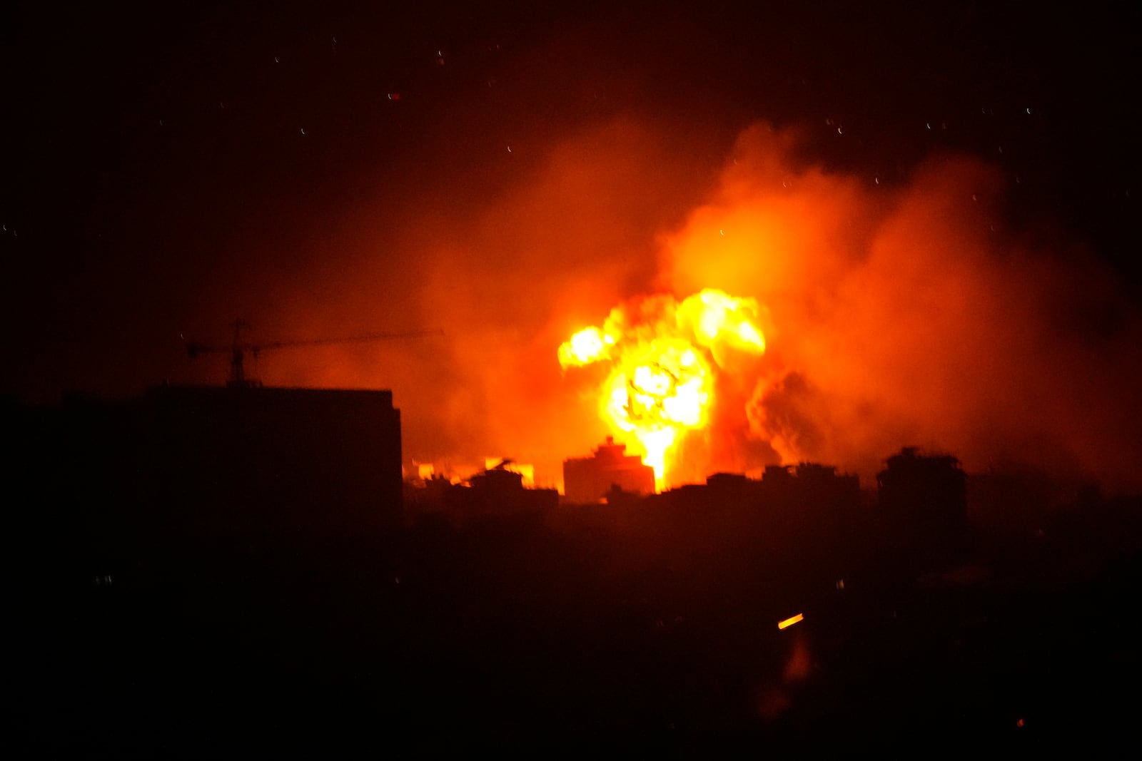 Flames and smoke rise from an Israeli airstrike in Dahiyeh, Beirut, Lebanon, early Sunday, Oct. 6, 2024. (AP Photo/Hussein Malla)