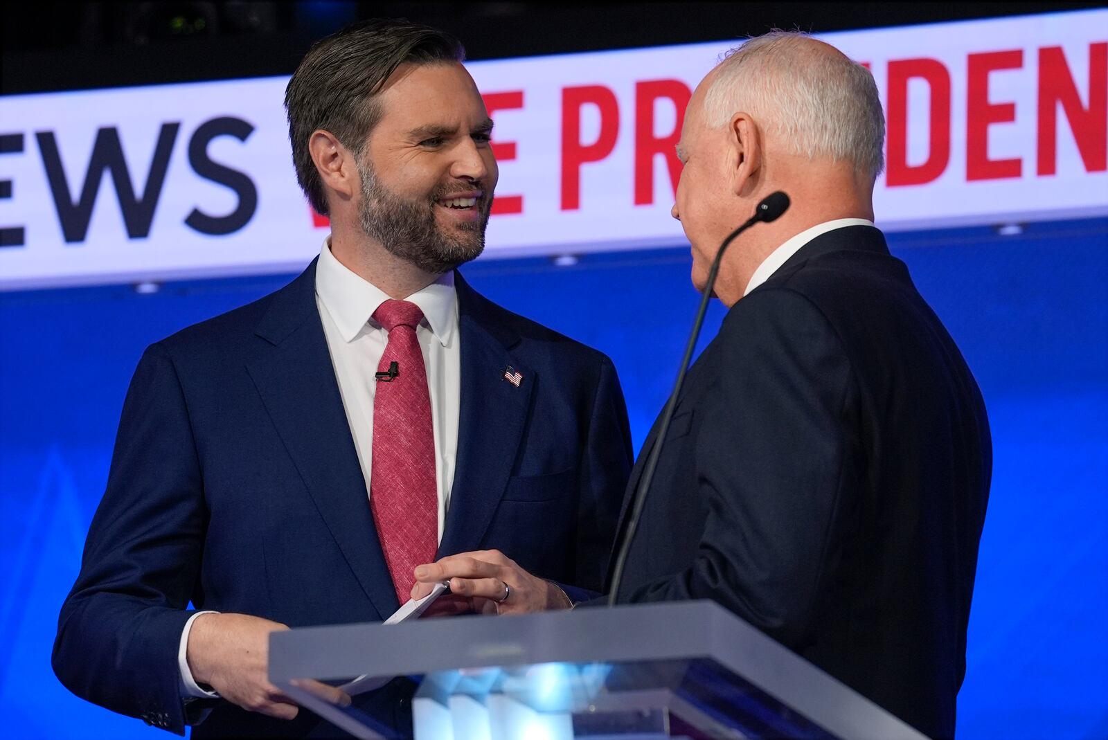 Republican vice presidential nominee Sen. JD Vance, R-Ohio, talks with Democratic vice presidential candidate Minnesota Gov. Tim Walz after the vice presidential debate hosted by CBS News Tuesday, Oct. 1, 2024, in New York. (AP Photo/Matt Rourke)