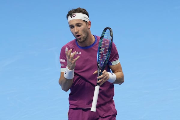 Norway's Casper Ruud reacts during a semifinal tennis match of the ATP World Tour Finals against Italy's Jannik Sinner at the Inalpi Arena in Turin, Italy, Saturday, Nov. 16, 2024. (AP Photo/Antonio Calanni)